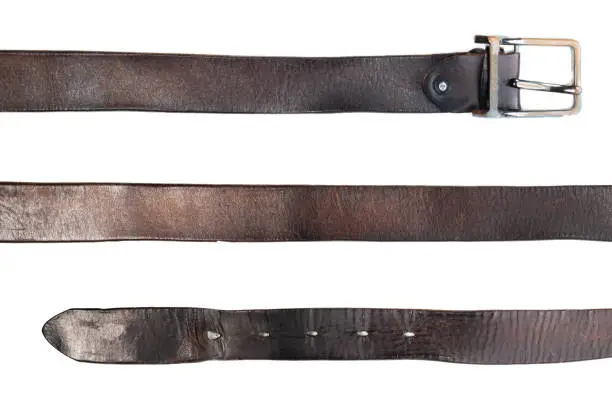 Photo of old black leather belt on white background