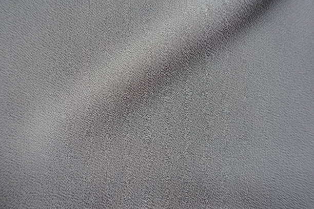 istock Single diagonal soft folds on grey crepe georgette fabric 1154073191