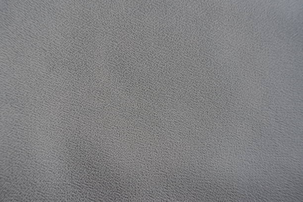 Surface of grey crepe georgette fabric from above Surface of grey crepe georgette fabric from above unprinted stock pictures, royalty-free photos & images