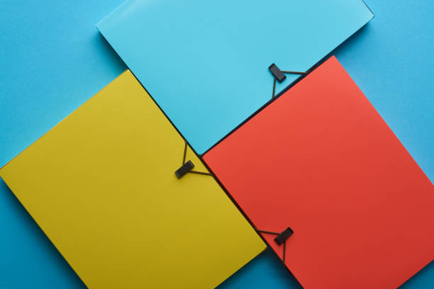 istock top view of arranged colorful paper folders on blue 1154073564