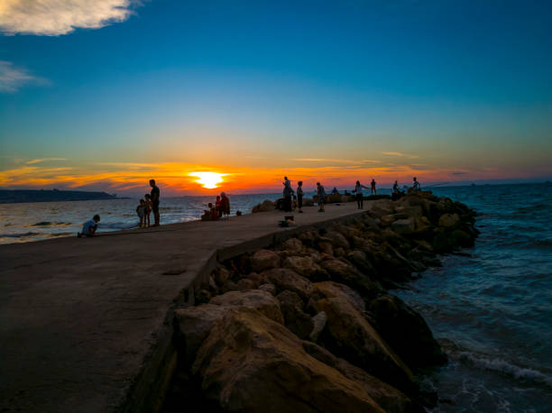 istock Dawn at the wave breaker 1154079308
