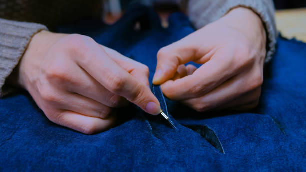 istock Skinner working with beaver fur skin 1154079714