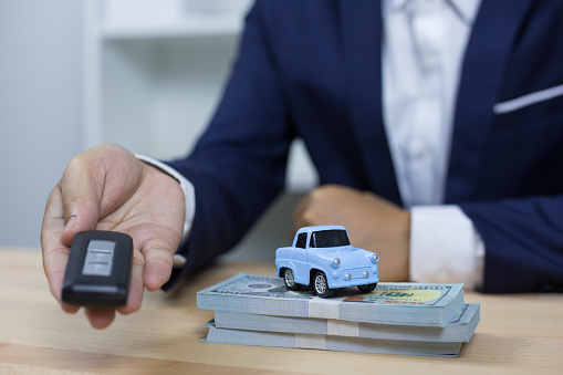 Business concept, car insurance, sell and buy car, car financing, car key for Vehicle Sales Agreement.