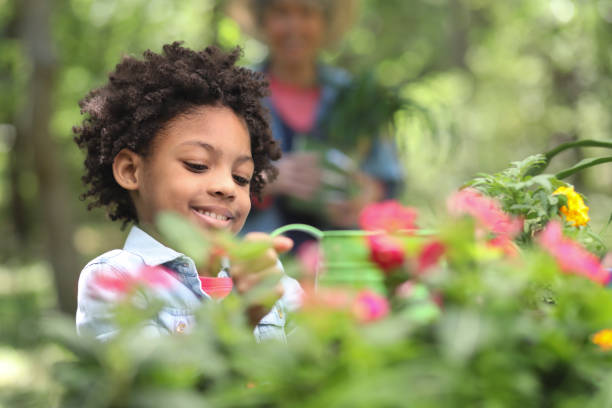 istock Grandmother and child gardening outdoors in spring. 1154081704