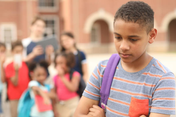 istock Junior high age boy being bullied at school. 1154082935