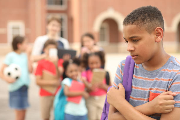 istock Junior high age boy being bullied at school. 1154082956