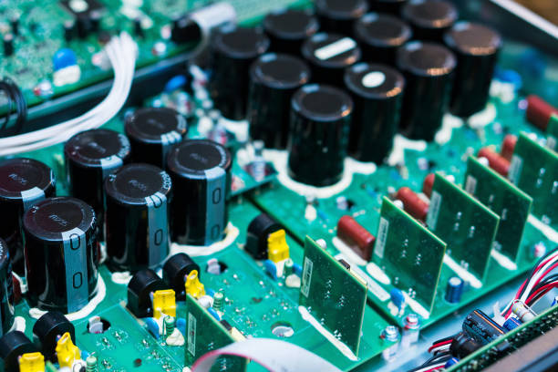 istock Resistors, capacitors and other electronic components of micro chip inside the computer close up 1154083211