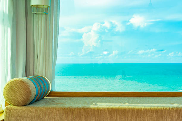 istock Beautiful comfortable pillow on sofa with sea ocean white cloud on blue sky view 1154083385