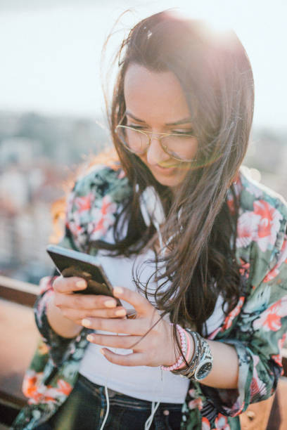 istock Young woman celebrates on the roof 1154084293
