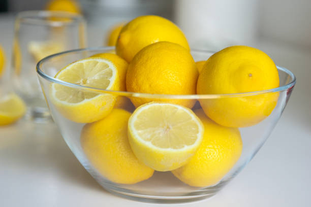 istock Freshly sun drenched lemons, on background Bokeh. 1154084908