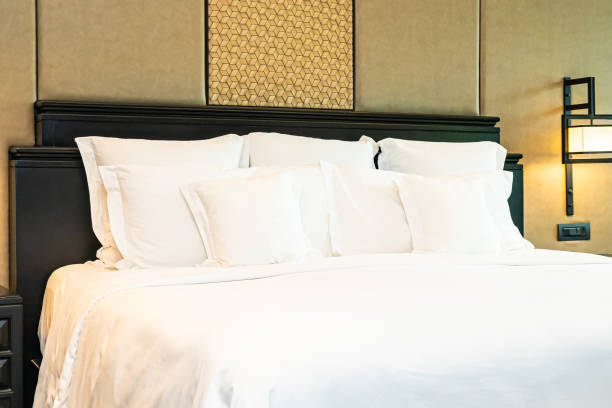 istock Beautiful luxury comfortable white pillow on bed decoration in bedroom 1154085001