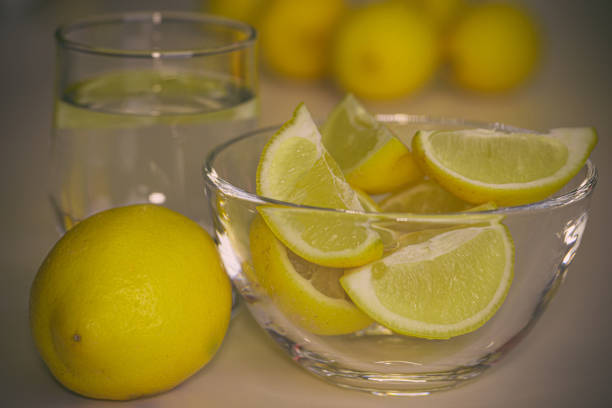 istock Freshly sun drenched lemons, on background Bokeh. 1154085014