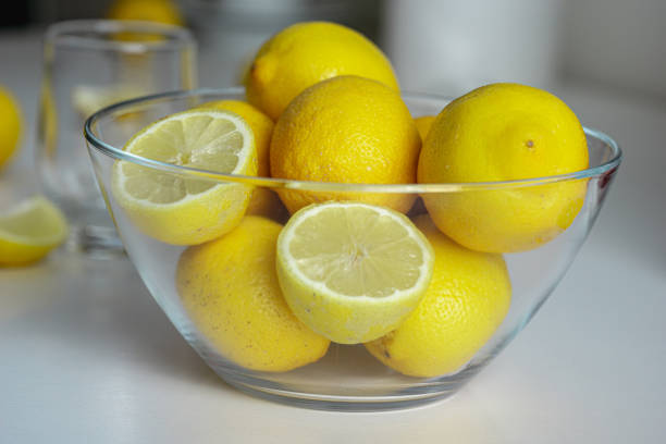 istock Freshly sun drenched lemons, on background Bokeh. 1154085241