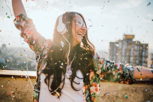 istock Young woman celebrates on the roof 1154085475