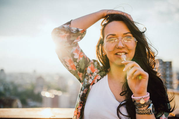 istock Young woman celebrates on the roof 1154086439