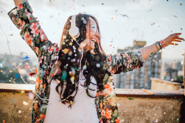 istock Young woman celebrates on the roof 1154087972