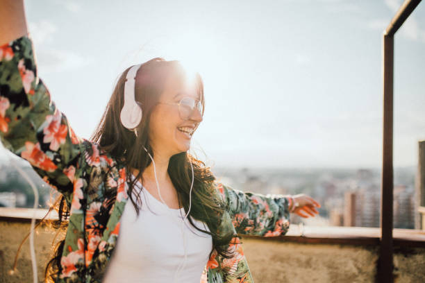 istock Young woman celebrates on the roof 1154088617