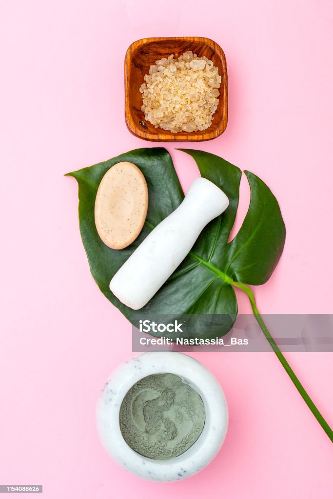 Natural skin care. Mask of clay on pink background Beauty Product Stock Photo