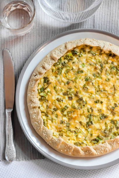 istock Tart with eggs and green onions on a plate 1154088995