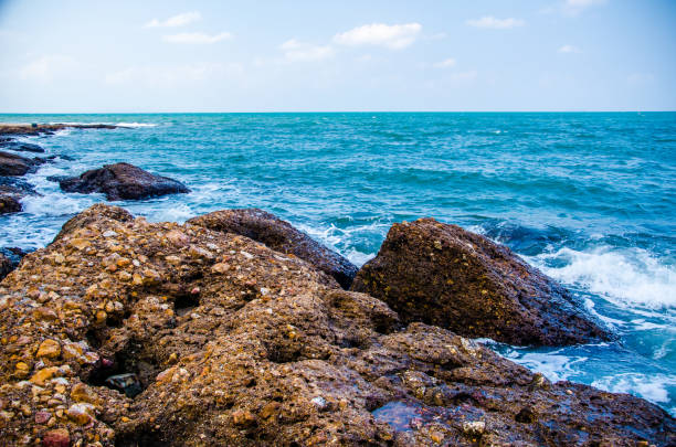 istock Ocean waves breaking on the rocks on the shore. 1154090358