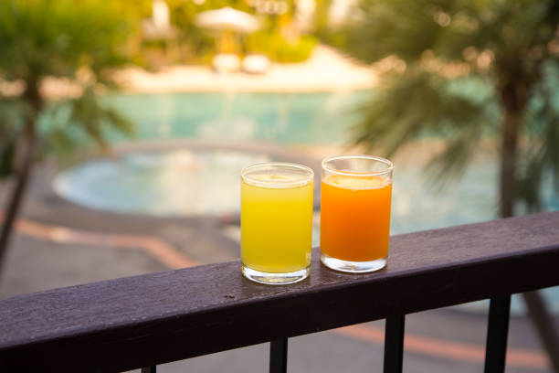 istock Orange juice around a swimming pool 1154091100
