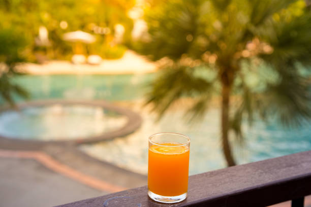 istock Orange juice around a swimming pool 1154091134