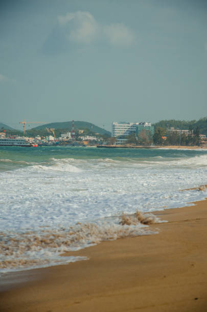 istock seashore. sandy beach. sunny summer day. blue water 1154098384