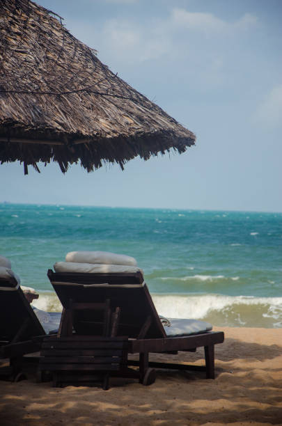 istock sun lounger on the beach. warm summer day. 1154098400