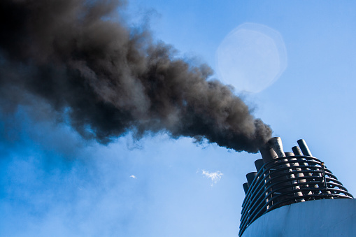 Ships funnel emitting black smoke, air pollution