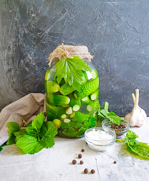 istock pickled cucumbers in a jar, garlic in the kitchen 1154100629