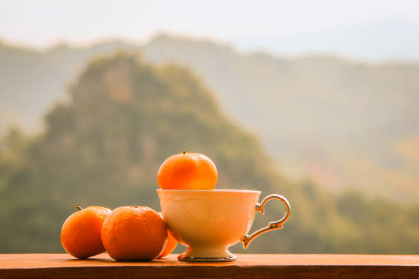 istock Orange fruits placed on wooden floors 1154102083