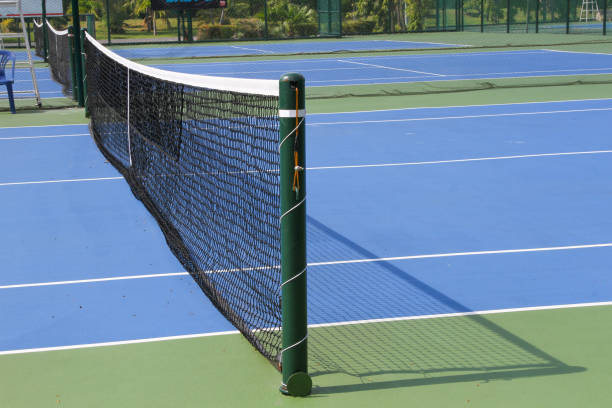 istock Tennis court outdoors with net in daylights 1154102157