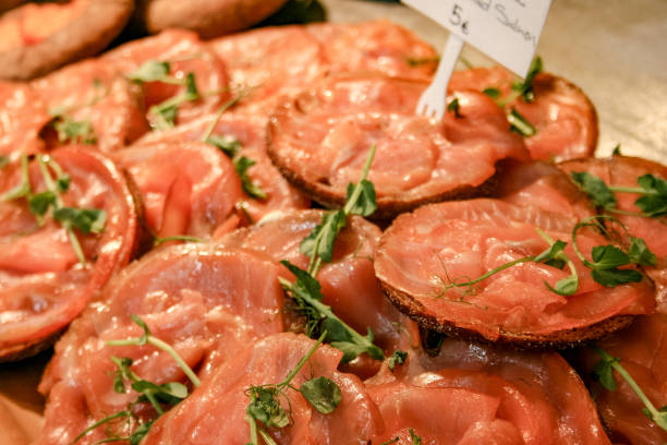 istock Salted smoked sliced salmon with black bread 1154102273