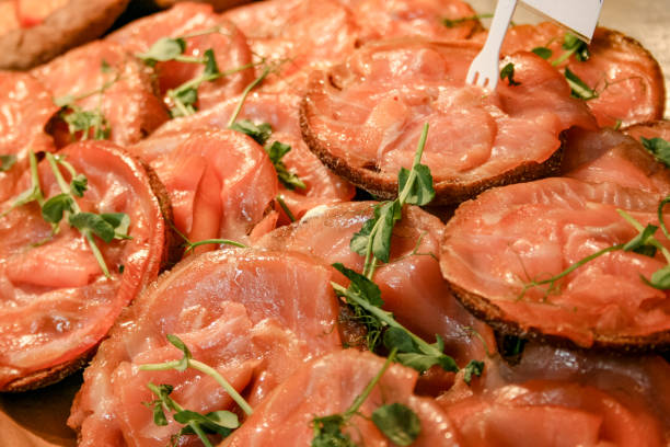 istock Salted smoked sliced salmon with black bread 1154102274