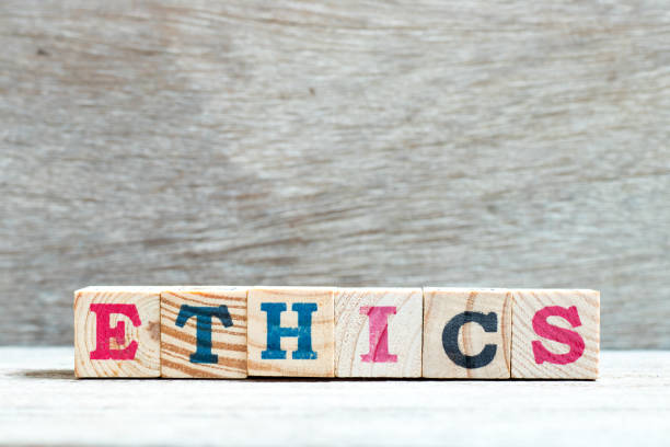 istock Alphabet letter block in word ethics on wood background 1154102331