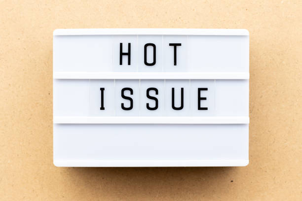 istock Light box with word hot issue on wood background 1154102372