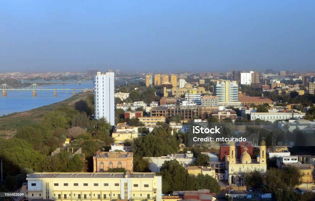 Khartoum downtown skyline and the Blue Nile, Sudan Khartoum, Sudan: skyline of the Sudanese capital - downtown area, waterfront along the Blue Nile river, government buildings, presidential palace, churches... Khartoum Stock Photo