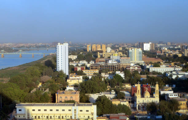 Khartoum downtown skyline and the Blue Nile, Sudan Khartoum, Sudan: skyline of the Sudanese capital - downtown area, waterfront along the Blue Nile river, government buildings, presidential palace, churches... blue nile stock pictures, royalty-free photos & images