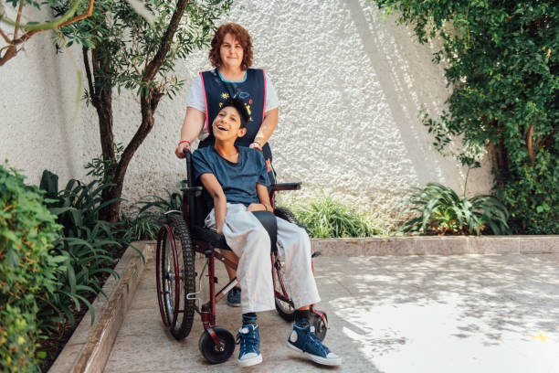 istock Healthcare worker helping patient with Cerebral Palsy 1154103530