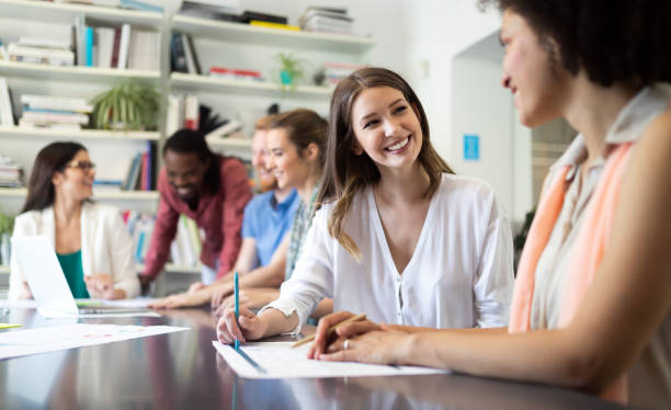 istock Successful group of business people at work in office 1154104903