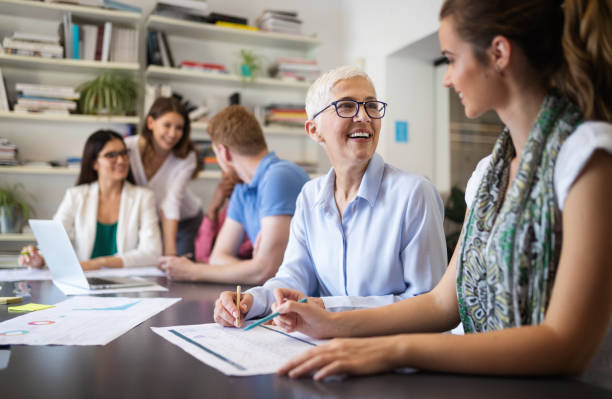 istock Successful group of business people at work in office 1154104942