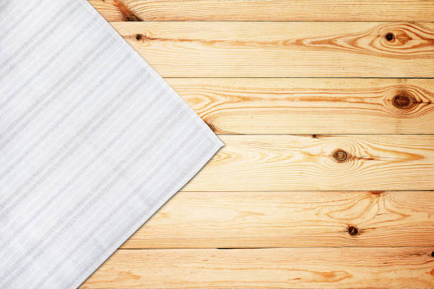 istock Old vintage wooden table with white tablecloth. Top view mockup. 1154105000