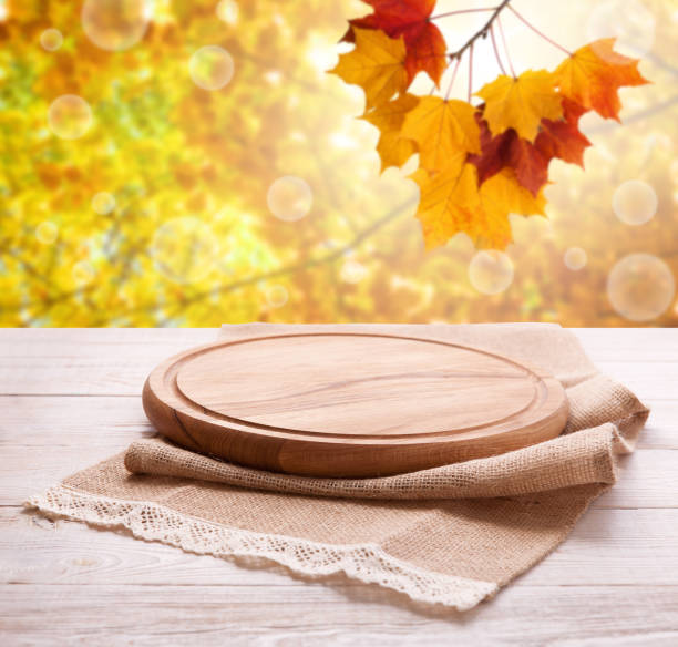 istock Pizza board with tableclothe on wooden desk. Autumn background. Top view mock up. Selective focus. 1154105109