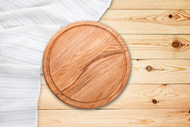 istock Table cloth and pizza board on vintage wooden table. Top view mockup 1154106811
