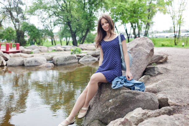 istock Young happy woman smiling enjoying spring day 1154108750