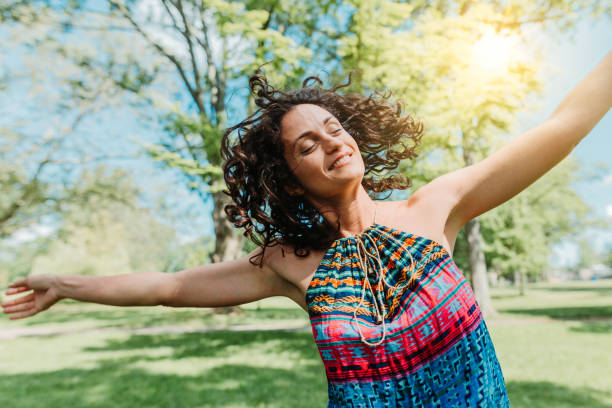 istock Dancing woman enjoying life 1154108848