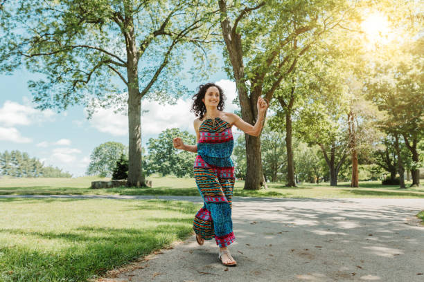 istock Dancing woman enjoying life 1154108863
