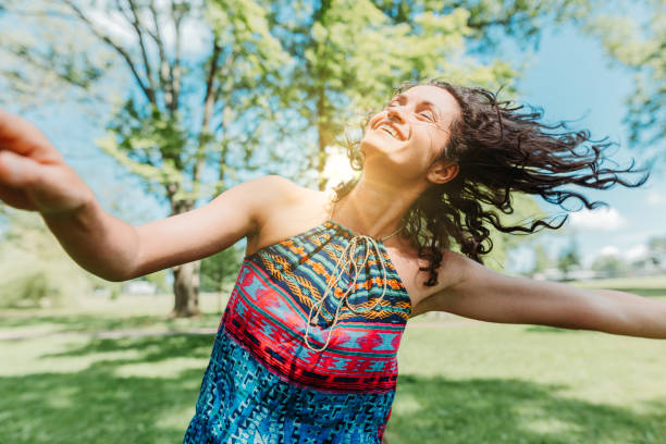istock Dancing woman enjoying life 1154108864
