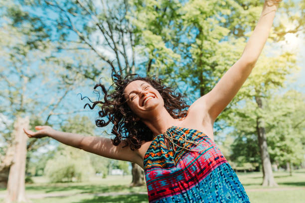 istock Dancing woman enjoying life 1154109101