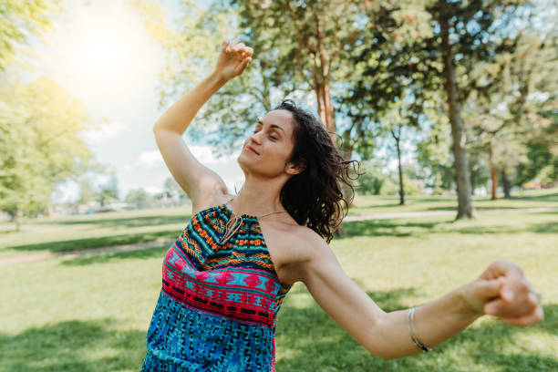 istock Dancing woman enjoying life 1154109125